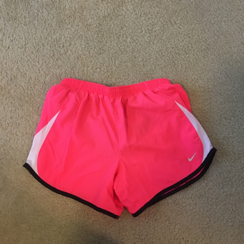 Neon pink Nike running shorts